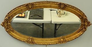Victorian Carved Giltwood and Gessoed Oval Mirror.