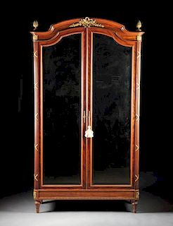 A LOUIS XVI STYLE GILT BRONZE MOUNTED MAHOGANY ARMOIRE WITH MIRROR PANELED DOORS, LATE 19TH/EARLY 20TH CENTURY,