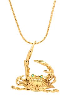An 18 Karat Yellow Gold and Emerald Blue Crab Pendant, Carson's, Circa 1990, 9.30 dwts.