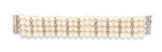 A 14 Karat White Gold, Diamond and Cultured Pearl Bracelet, 29.90 dwts.