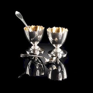 A CASED  PAIR OF AMERICAN SILVER AND SILVER GILT FIGURAL SALTS AND SPOONS, CIRCA 1870,
