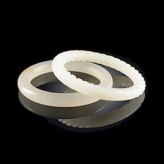 A GROUP OF TWO CHINESE WHITE JADE BANGLES, MODERN,