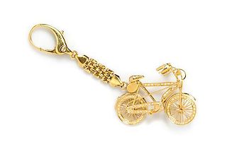 A 18 Karat Yellow Gold and Diamond Articulated Bicycle Key Chain, Italian, 18.20 dwts.