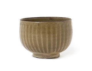 * A Chinese Green Glazed Stoneware Bowl Height 3 1/4 inches.