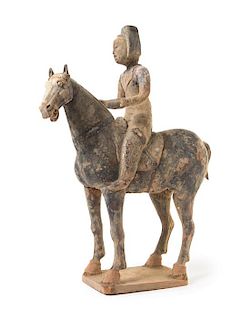 * A Chinese Grey Pottery Equestrian Figure Height 19 inches.