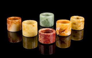 Six Chinese Hardstone Archer's Rings Diameter of largest 1 3/8 inches.