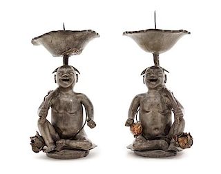 A Pair of Chinese Pewter Figural Form Candle Holders Height of each 8 1/4 inches.
