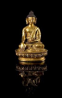 A Small Sino-Tibetan Gilt Bronze Figure of Buddha