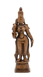 An Indian Copper Figure of Lakshmi Height 4 1/4 inches.