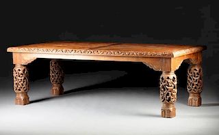 A SPANISH COLONIAL STYLE CARVED OAK DINING TABLE,