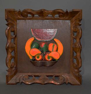 Hanging wood carving of a basket of fruit