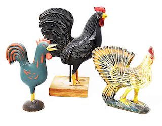 3 carved wooden chickens