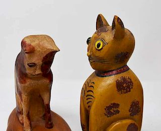 4 carved wooden cats