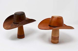 2 delicately made wooden cowboy hats