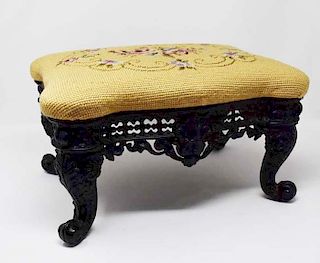 Footstool with ornate cast iron frame