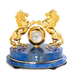 A Gilt Metal and Lapis Lazuli Veneered Clock Height 12 1/2 inches.