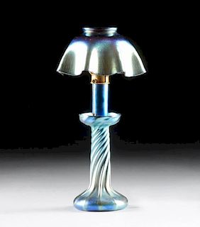 A TIFFANY STUDIOS BLUE FAVRILE GLASS CANDLESTICK LAMP, ENGRAVED "L.C.T.' AND "Favrile," CIRCA 1910,