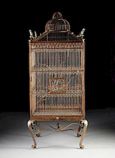 A LARGE VICTORIAN STYLE BRONZED WROUGHT IRON BIRD CAGE ON STAND, MODERN,