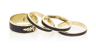 A Collection of Yellow Gold and Black Enamel Rings, 5.90 dwts.