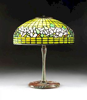 A TIFFANY STUDIOS BANDED DOGWOOD STAINED GLASS SHADE AND PATINATED BRONZE BASE, EACH STAMPED, BASE NUMBERED 337,