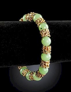A 14K YELLOW GOLD AND GREEN JADE LADY'S BRACELET,