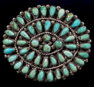 A ZUNI PETTIPOINT STERLING AND TURQUOISE BROOCH