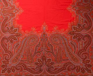 A LARGE FINE RED PAISLEY PIANO SCARF OR SHAWL