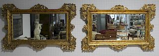 Pair of Italian Carved and Gilt Wood Mirrors.
