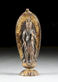 A SOUTH EAST ASIAN PARCEL GILT CARVED WOOD FIGURE OF GUANYIN, EARLY 20TH CENTURY,