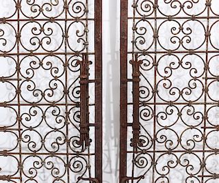 AN EXCEPTIONAL HAND FORGED ORNAMENTAL IRON ENTRY