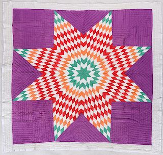 A VINTAGE LONE STAR QUILT WITH ELABORATE QUILTING