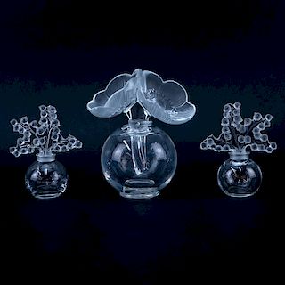 Group of Three (3): Pair of Lalique "Lily of the Valley" Crystal Perfume Bottles, Large Lalique "Anemone" Crystal Perfume Bottle. Each appropriately s