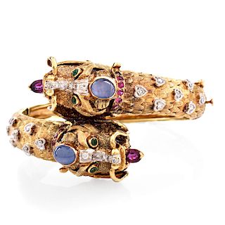 Vintage Heavy 14 Karat Yellow Gold Dragon Hinged Bangle Accented throughout with Cabochon Sapphires, Diamonds, Rubies and Emeralds. Stamped 14K JG JLR