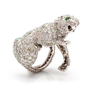 An 18 Karat White Gold, Diamond and Emerald Panther Ring, 10.15 dwts.