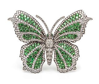 An 18 Karat White Gold, Green Garnet and Diamond Butterfly Brooch, 21.60 dwts.