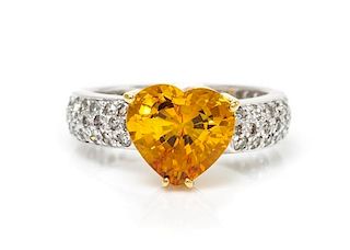 A Platinum, Yellow Gold, Yellow Sapphire and Diamond Ring, 4.40 dwts.