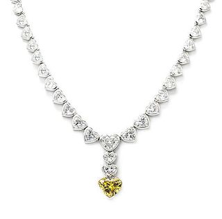 A Fine Platinum, Diamond and Fancy Deep Yellow Diamond Necklace, 38.40 dwts.