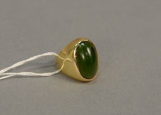 Tiffany 18 karat gold ring set with domed jade stone, marked inside: Tiffany N.Y., 14.6 grams, size 8