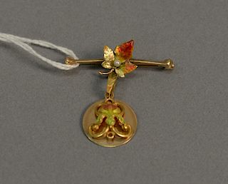 14 karat pin with enameled flower and leave, 4 grams.