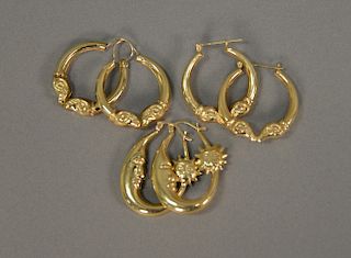 Three pairs of 14 karat gold earrings. 10.5 grams
