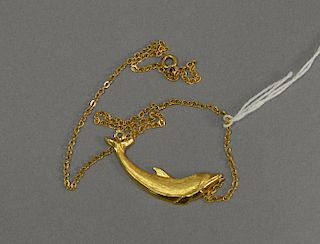 18 karat gold dolphin necklace.