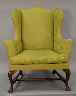 Kittinger Colonial Williamsburg Queen Anne style mahogany wing chair with stretcher base and pad feet, marked: Kittinger Furniture C...