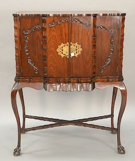 Chippendale style bar cabinet with ball and claw feet. ht. 55 1/2in., wd. 45in.