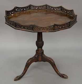 Mahogany tilt top tea table with pierced gallery top. ht. 29in., dia. 31in.
