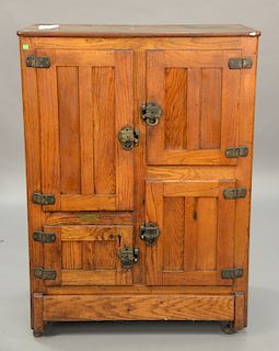 Oak three door ice box. ht. 51 1/2in., top: 20" x 37 1/2in.