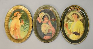 Three original Coca-Cola advertising tin tip/change trays. ht. 6in., 6in., & 6 1/4in.