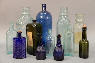 Group of twelve assorted glass bottles including Schenck's Pulmonic Syrup bottle, J. G. Godding & Co. Apothecaries Boston, Mass cobalt bottle