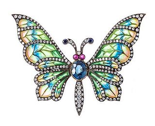 A Silver Topped Gold, Plique-A-Jour Enamel, Diamond, Ruby and Sapphire Butterfly Brooch, 17.00 dwts.