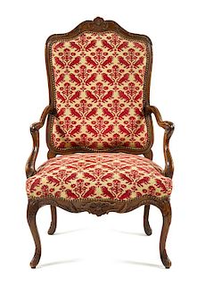 A Regence Walnut or Fruitwood Fauteuil Height 44 1/2 inches.
