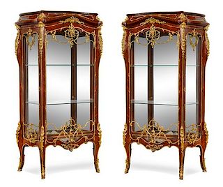 A Pair of Louis XV Style Gilt Bronze Mounted Vitrines Height 71 3/8 x width 42 1/2 x depth 17 inches.